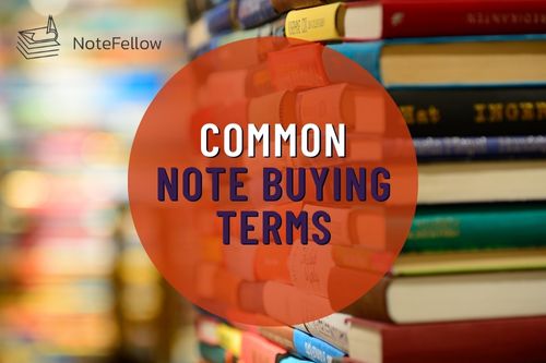 Image with Stacks of Books with Words Common Note Buying Terms